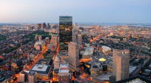 Urban city aerial view. Boston aerial view with skyscrapers at sunset with city downtown skyline.